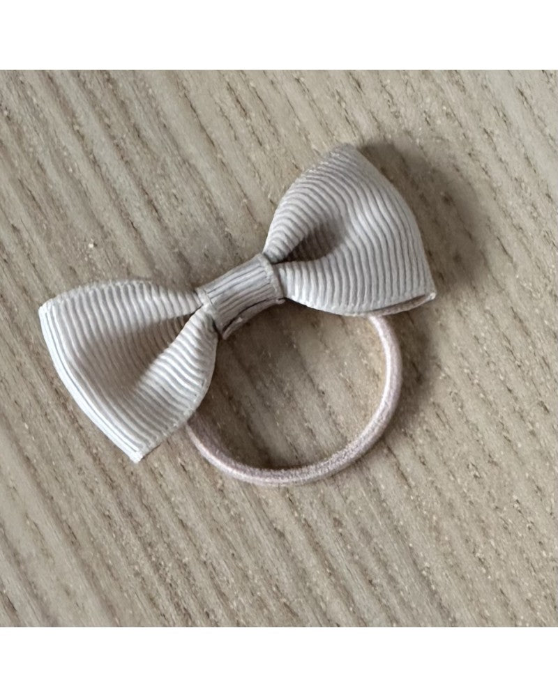 Μπεζ λαστιχάκι μαλλιών με φιόγκο