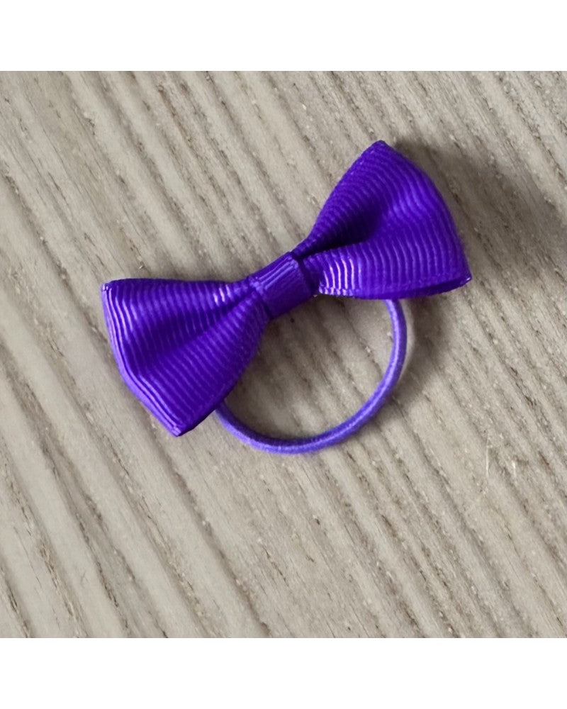 Έντονο μωβ λαστιχάκι μαλλιών με φιόγκο