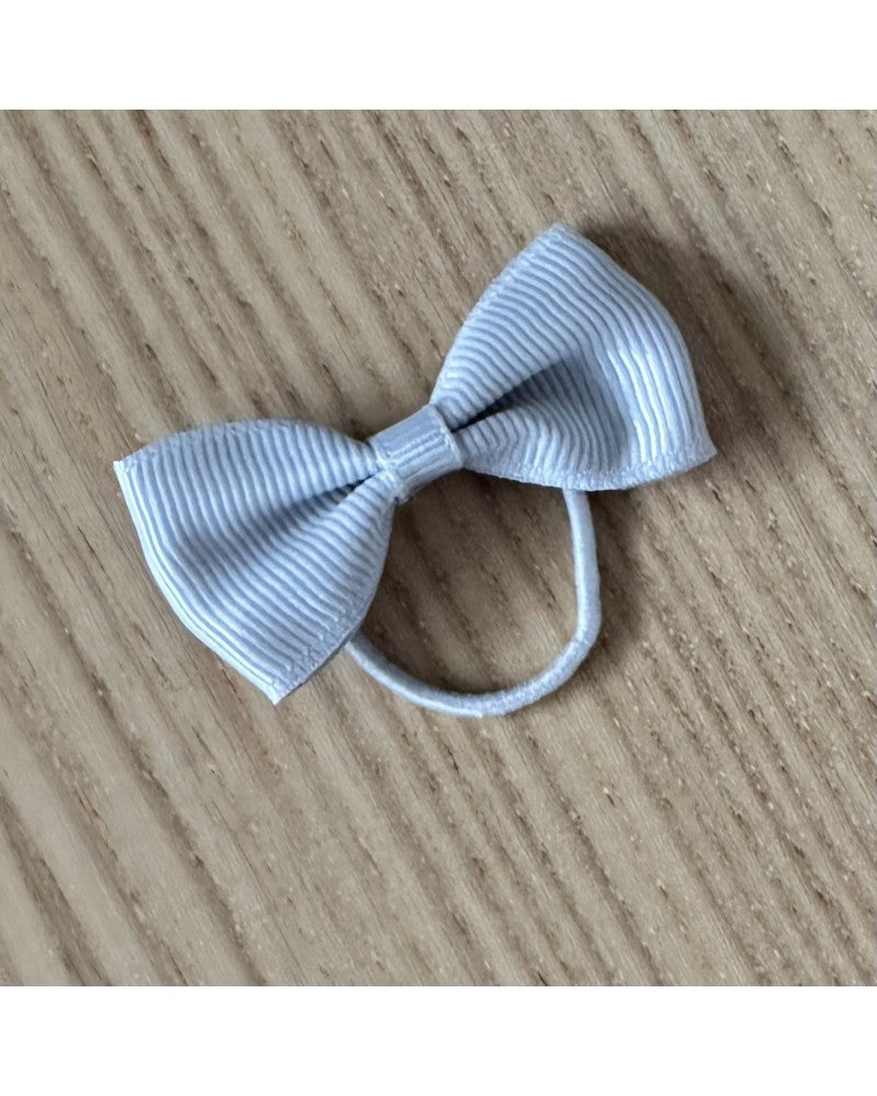 Ανοιχτό γκρί λαστιχάκι μαλλιών με φιόγκο